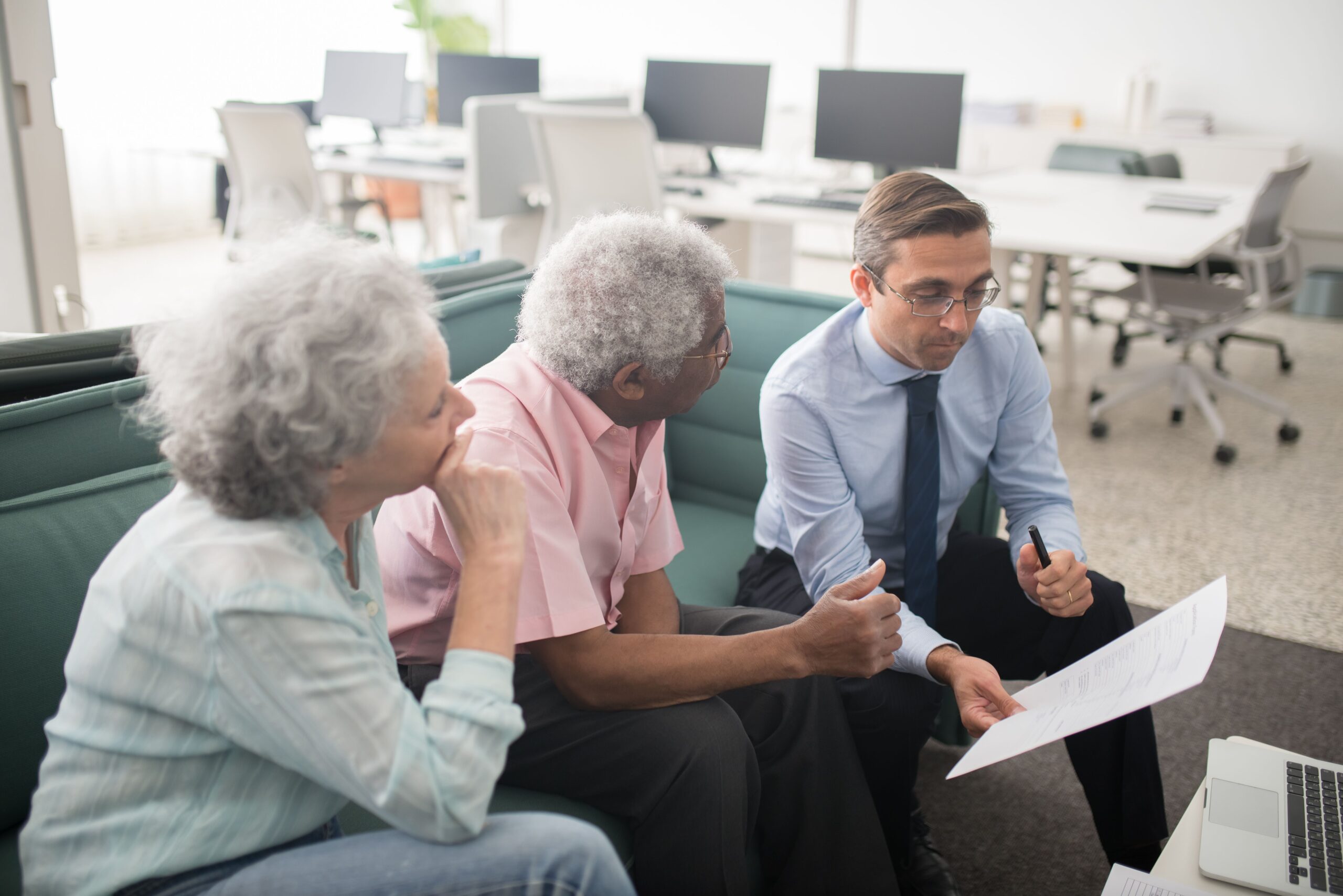 Advisor meeting with an older couple
